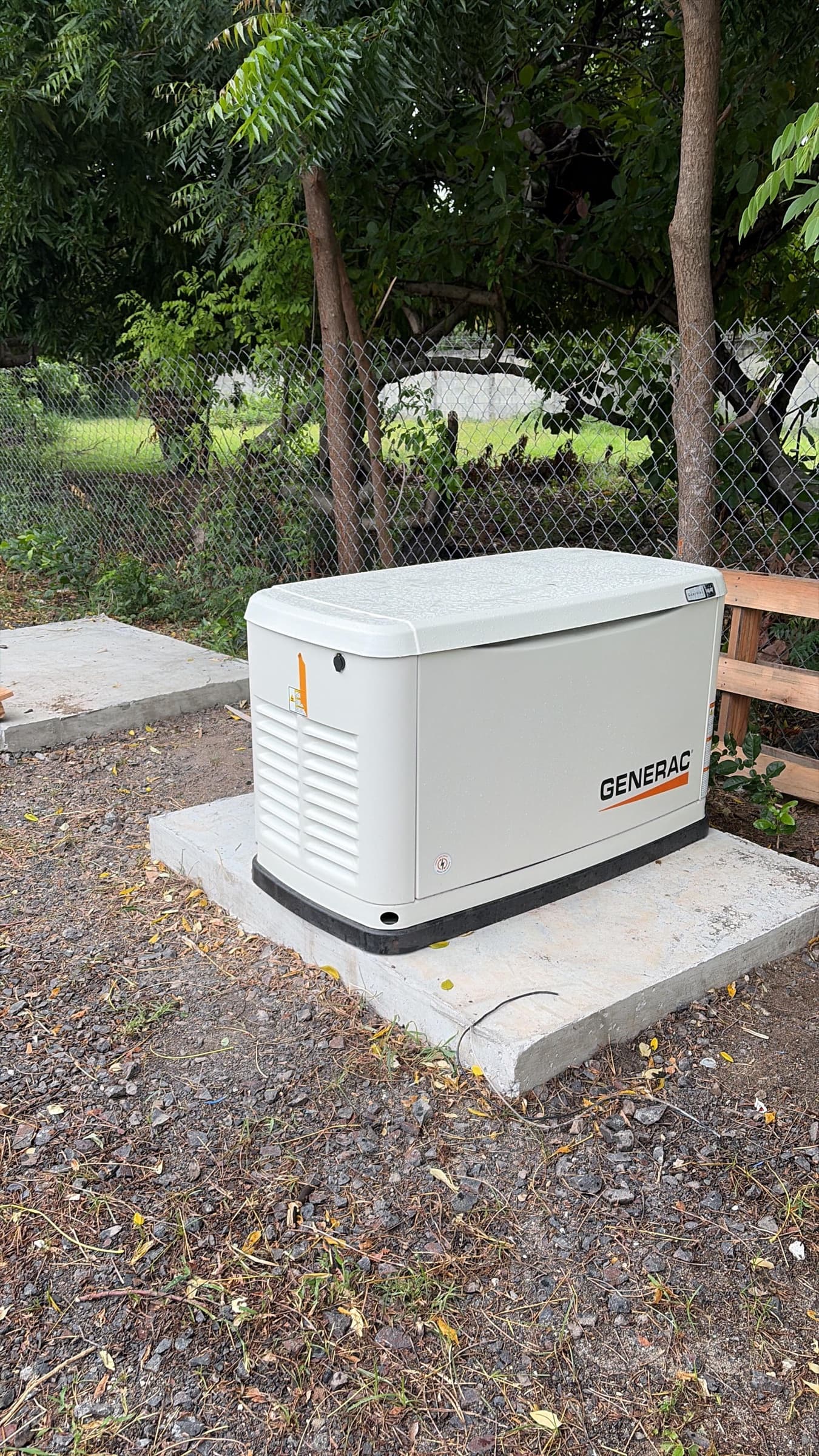Whole-home standby generator installed on its concrete pad